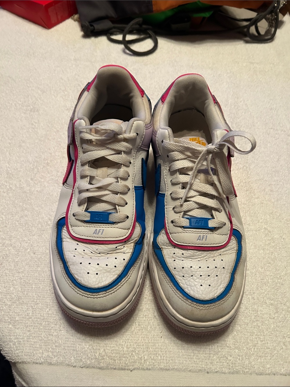 Nike White Sneakers with Blue and Pink Accents